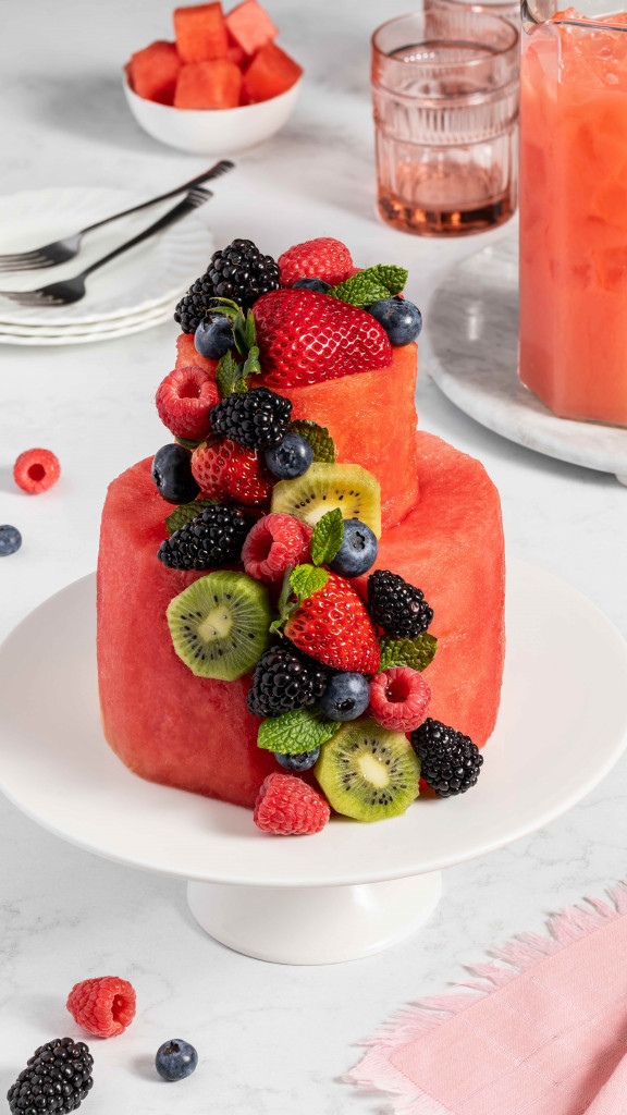 "Cake" made of watermelon and other fruit such as kiwi and berries set on a plate
