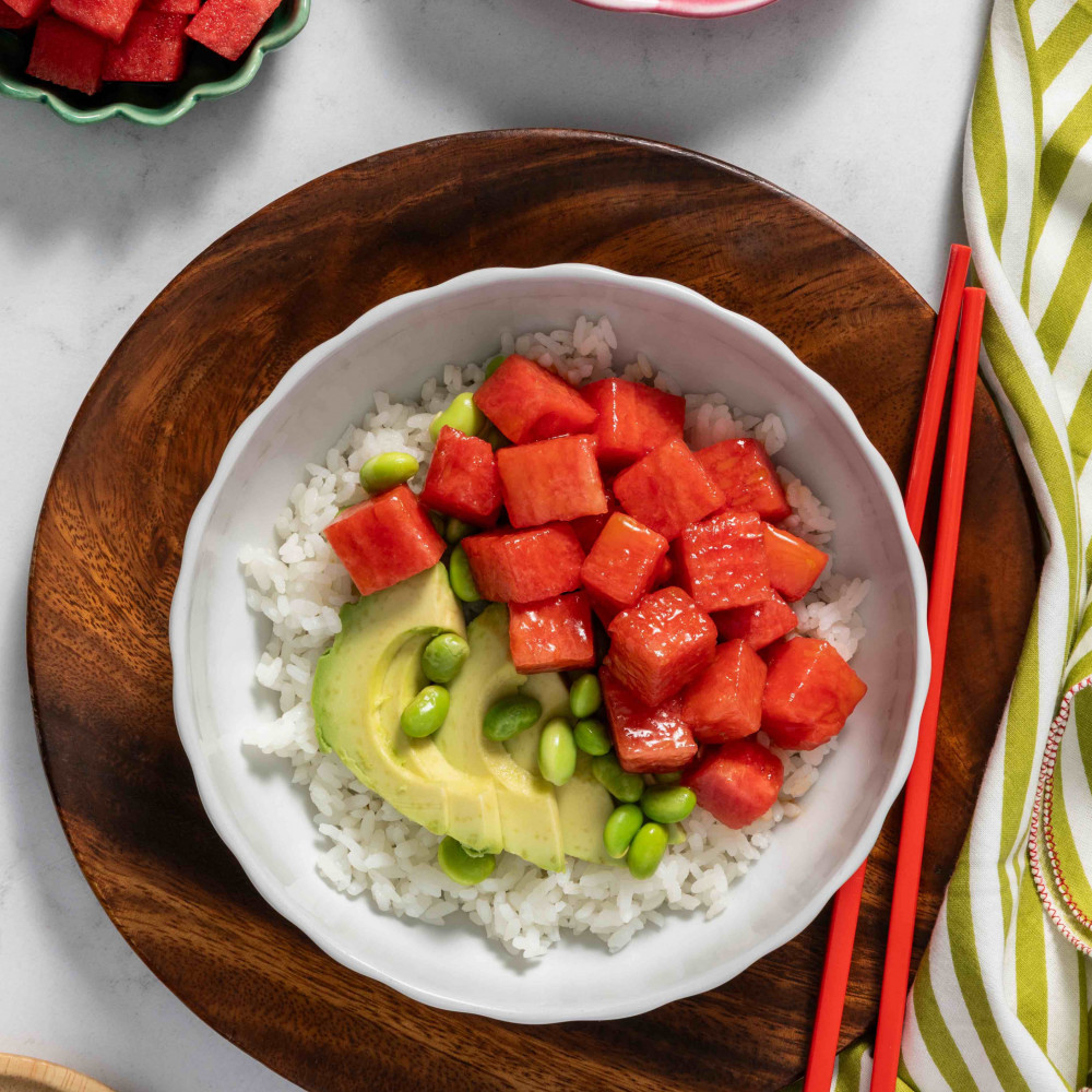 Marinated watermelon that looks like tuna with avocado, edamame and rice in a bowl